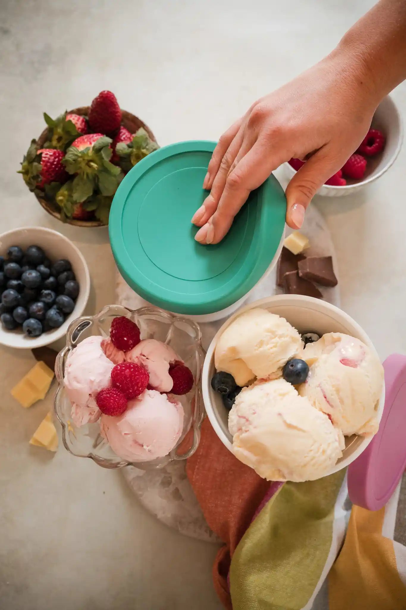 Starpack ice cream freezer storage containers with colorful, leak-proof silicone lids, designed for easy stacking and frost-free storage.