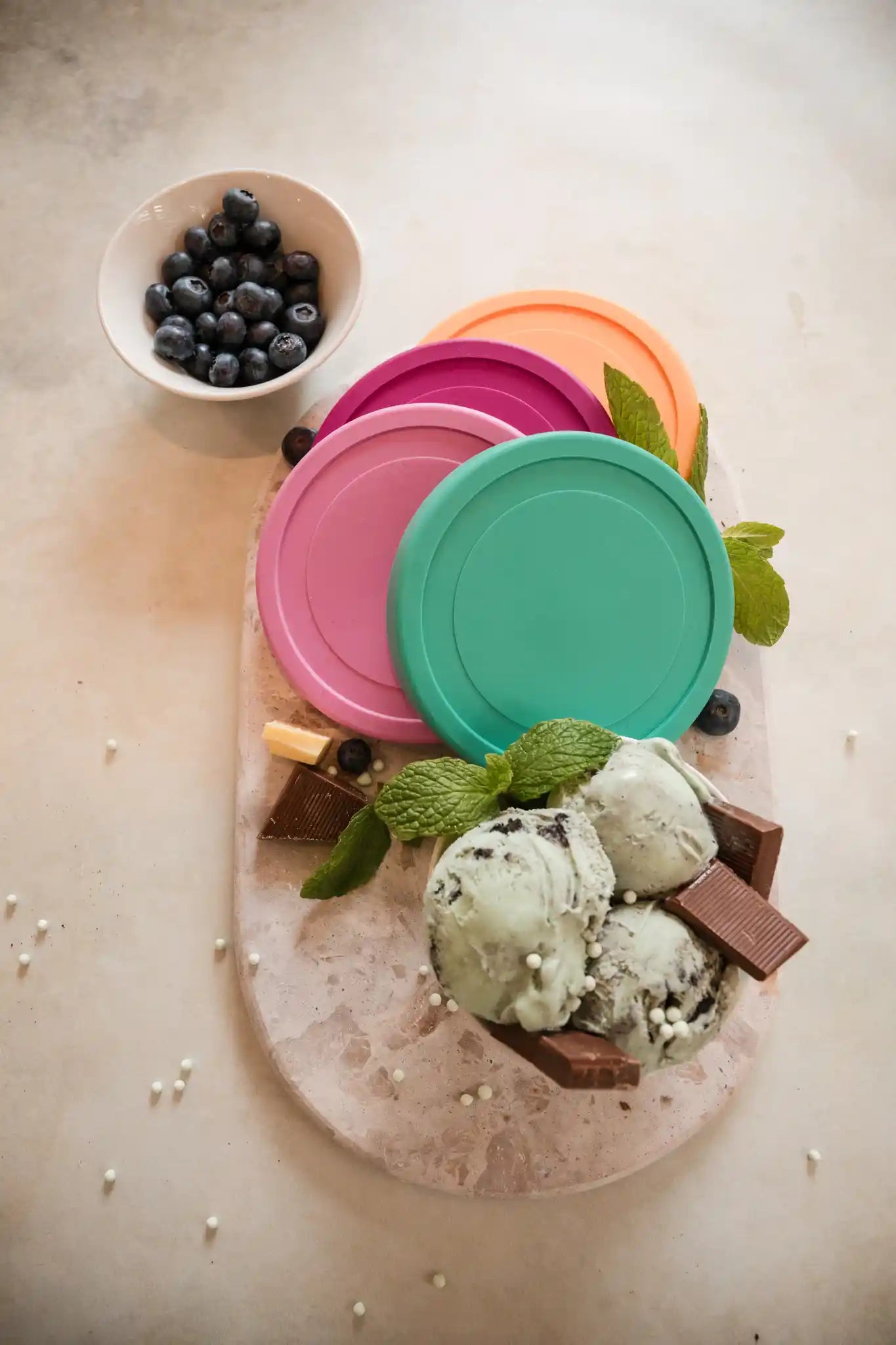 Starpack ice cream freezer storage containers with colorful, leak-proof silicone lids, designed for easy stacking and frost-free storage.