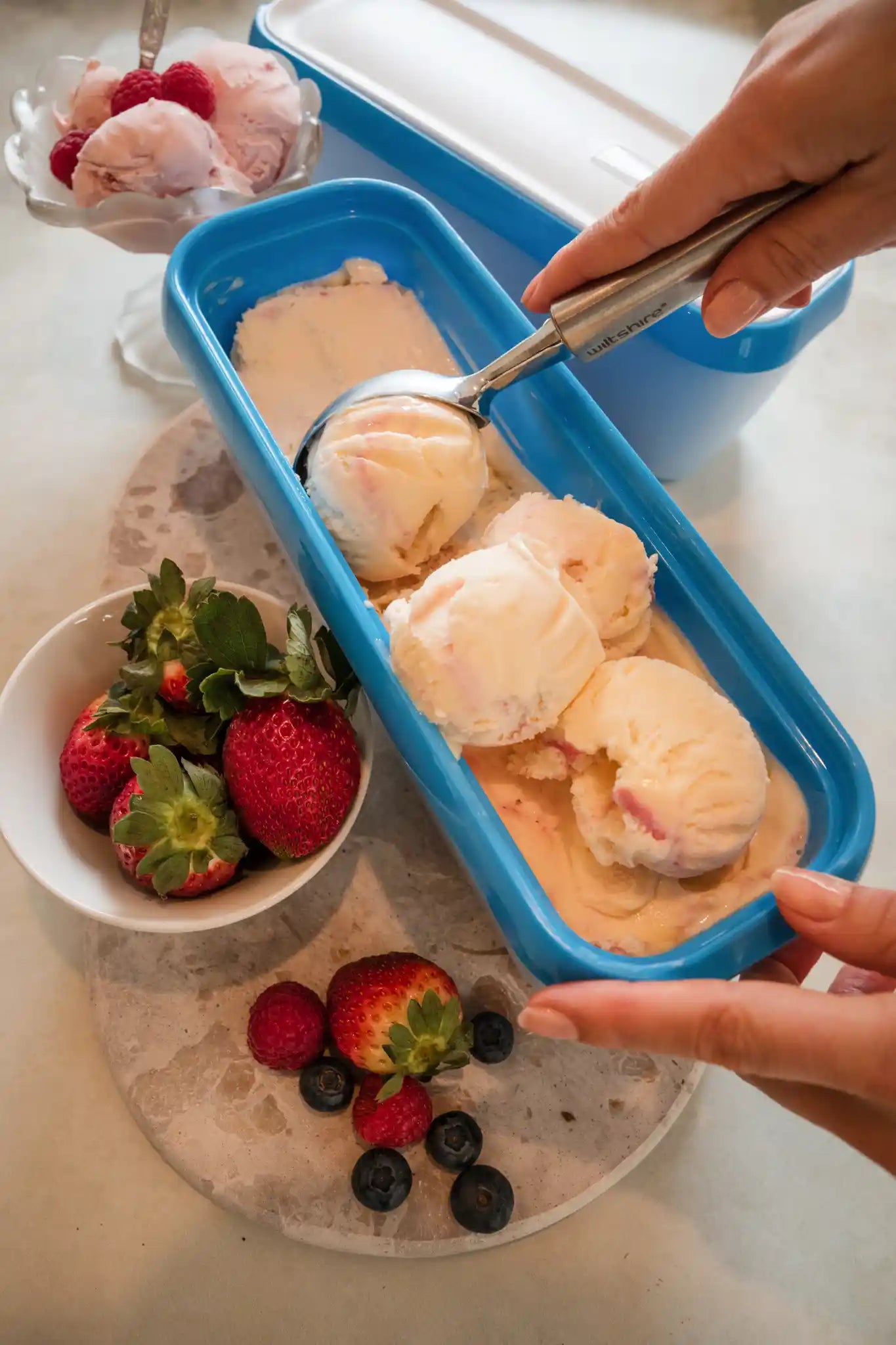 Starpack ice cream freezer storage containers with colorful, leak-proof silicone lids, designed for easy stacking and frost-free storage.
