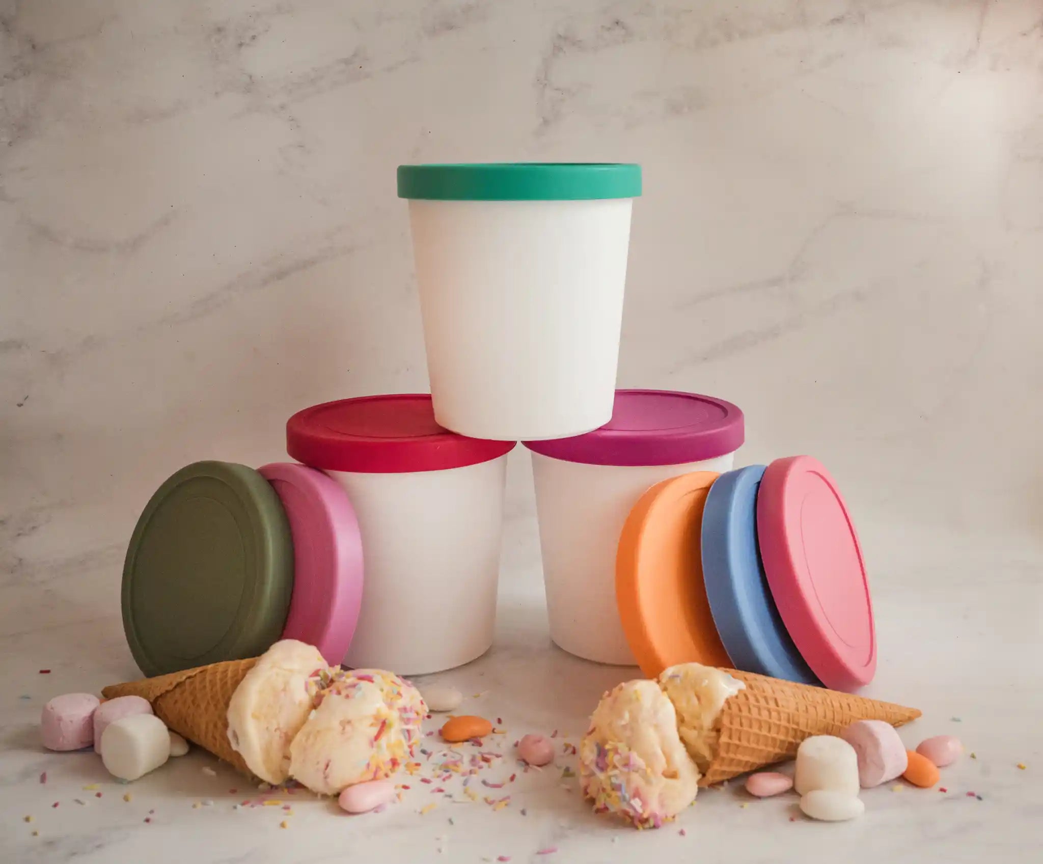 Starpack ice cream freezer storage containers with colorful, leak-proof silicone lids, designed for easy stacking and frost-free storage.