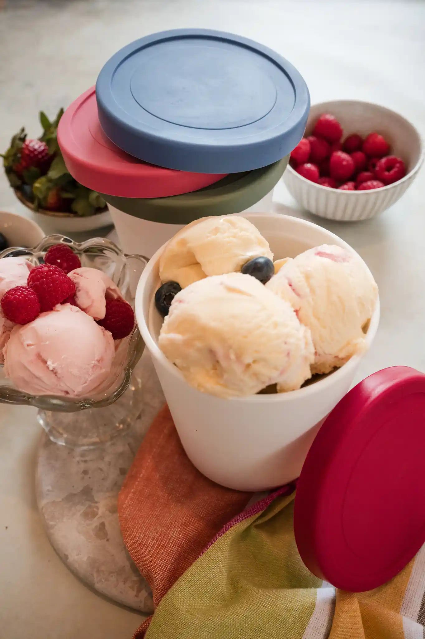 1Qt ice cream freezer storage containers from Starpack with colorful, stackable silicone lids, designed to be frost-free and leak-proof.