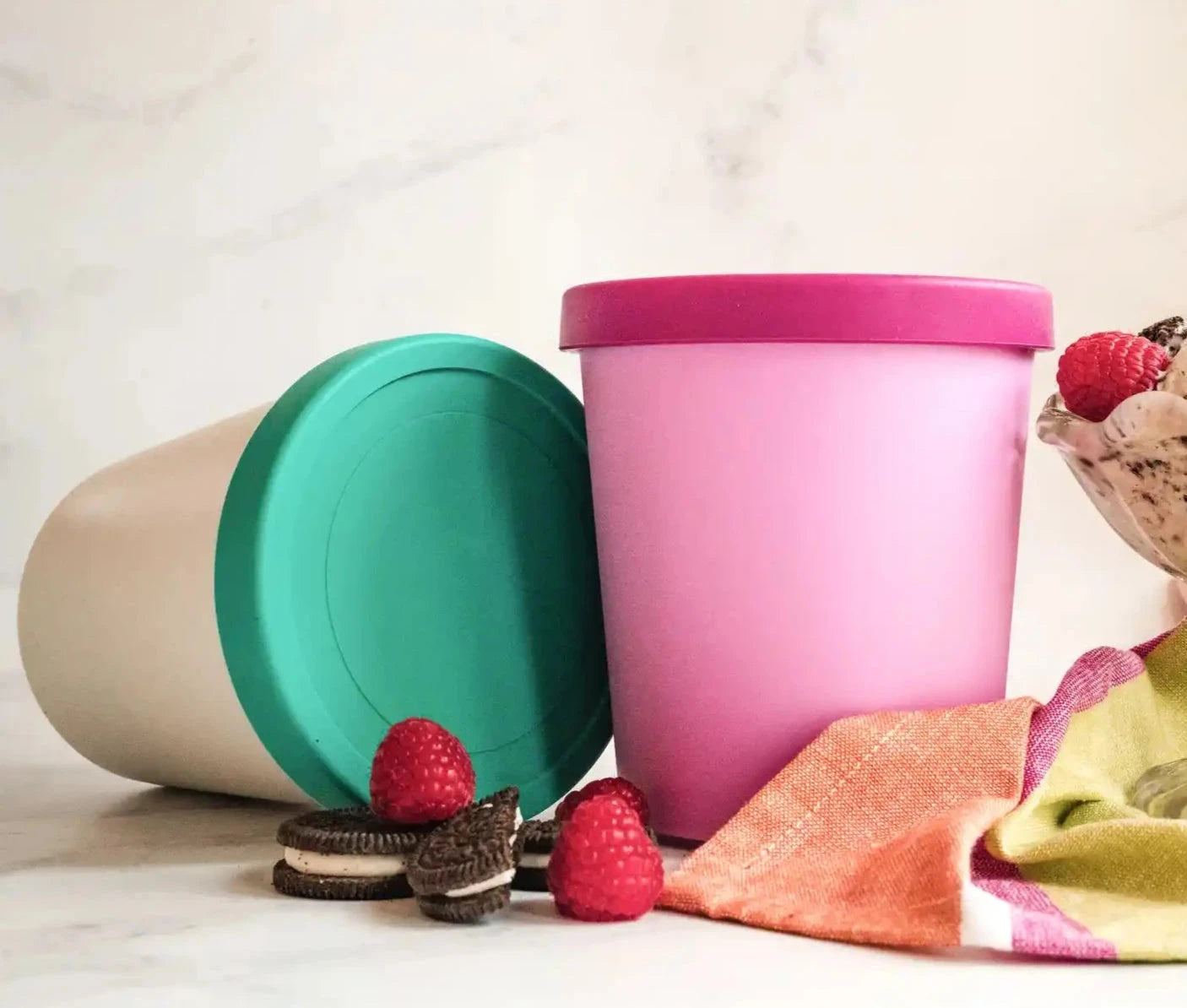 Starpack 2-pack ice cream freezer containers with colorful silicone lids, featuring a frost-free and leak-proof design, perfect for storing homemade ice cream.